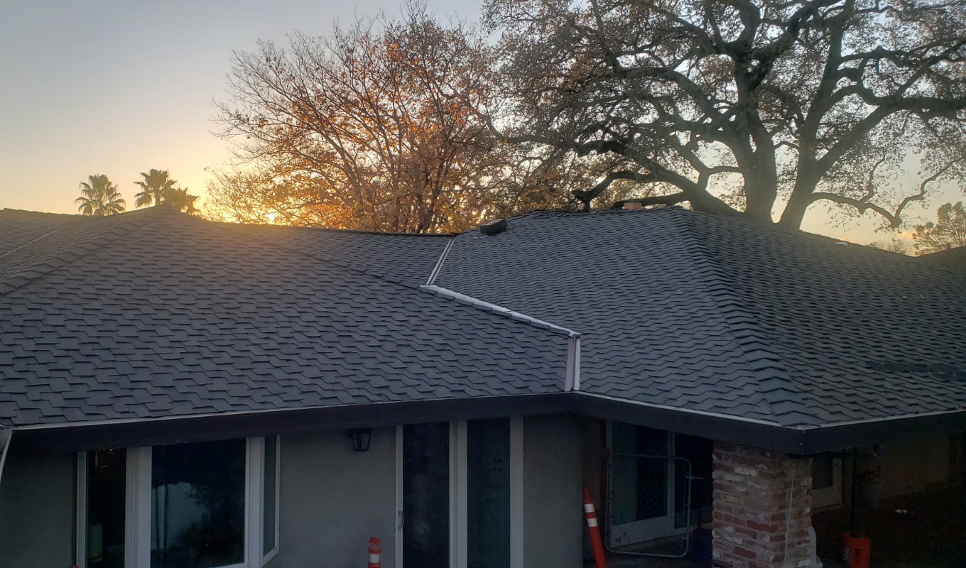 A luxury home with a new, elegant aspahñt shingle roof