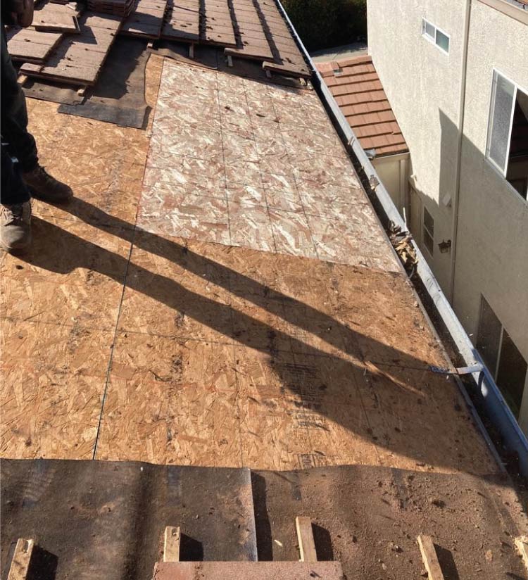 roof leak repair in progress in woodland, ca